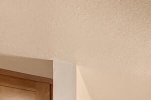 Apartments for Rent in Lake Oswego, OR - Westlake Meadows - Dining Area with a Rectangular Table, Four Chairs, a Sideboard, Wall Art, a Mirror, and a Modern Ceiling Light Fixture.